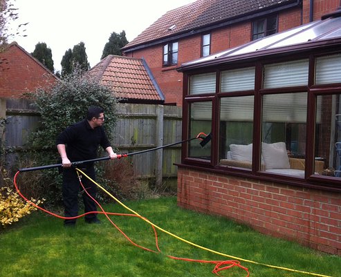 Clean windows on a house in Greenford